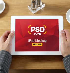 iPad in Hand Mockup Free PSD