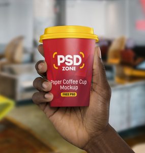 Hand Holding Paper Cup Mockup PSD